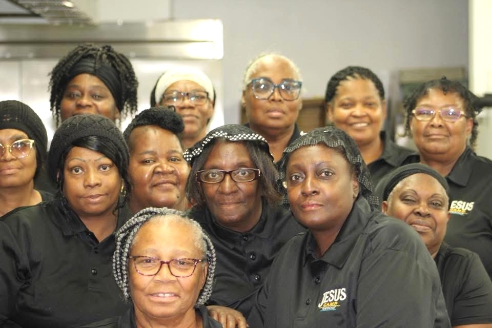 The kitchen and hospitality team in JCR uniforms