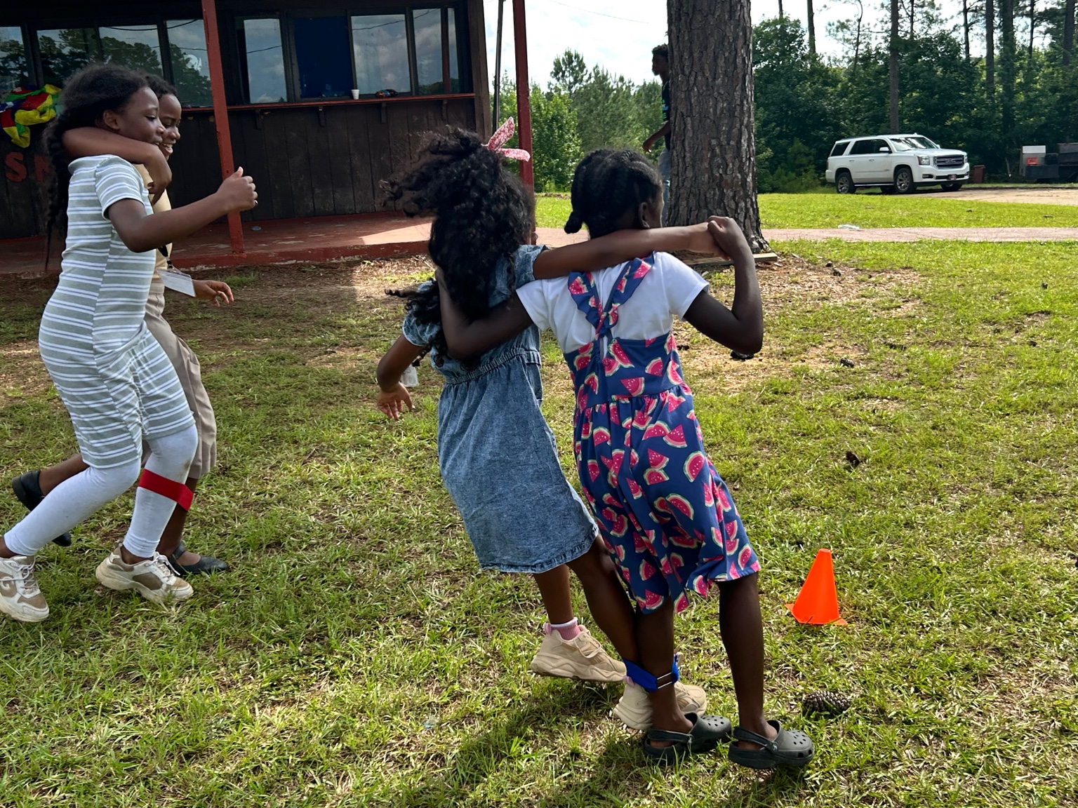 Youth girls playing and laughing at the camp