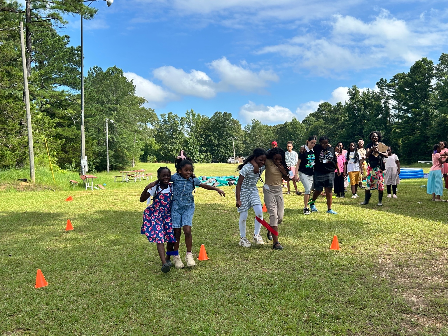 Youth running on race day at the camp